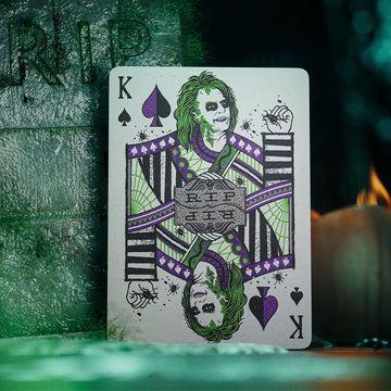 Unleash the fun with Beetlejuice Playing Cards! This hauntingly beautiful deck is packed with Easter eggs for fans of the classic film and its sequel. Featuring Beetlejuice